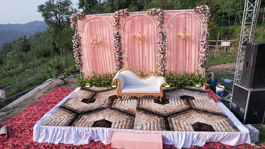 A decorated stage adorned with a sofa.