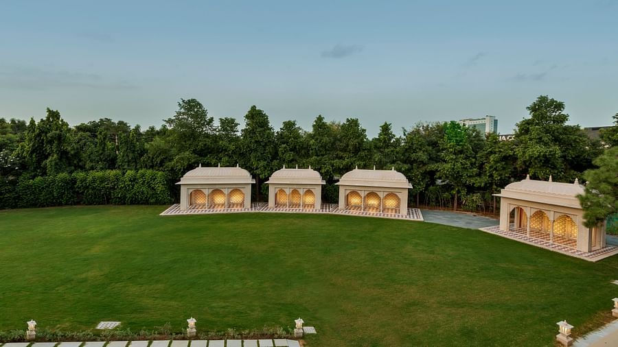 A top view of the venue Baradari with manicured grass in front of the buildings - heritage village resorts & spa, Manesar