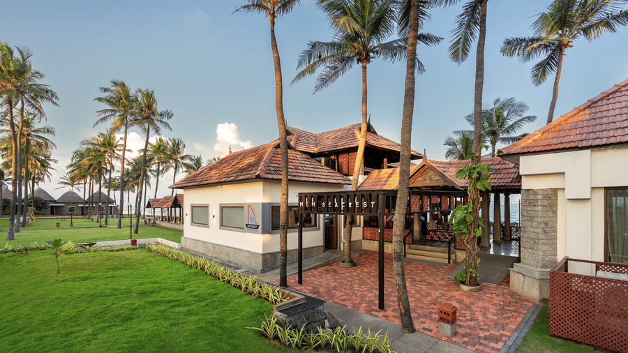 A space with plants, buildings, and trees by it | MGM Beach Resorts