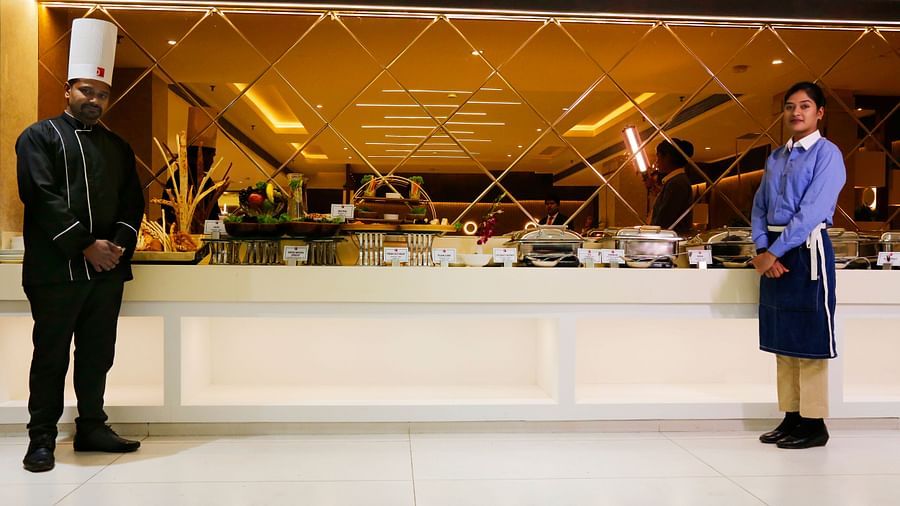 Sapna Clarks - the chef and a staff standing in front of the buffet