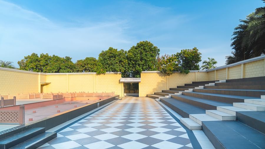 An image of an outdoor amphitheatre showcasing an open stage, coridor, and stairs where spectators sit - The Garden Ananta Elite, Rajkot