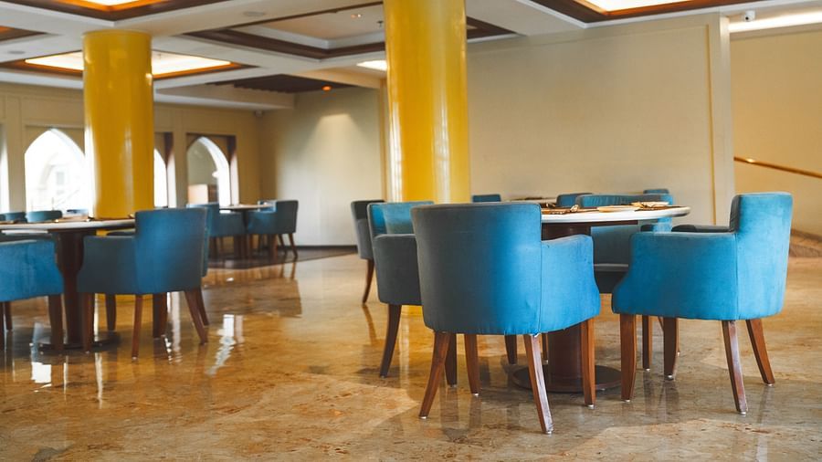An image of seating area with sofa sets and a centre table placed in a room -  The Garden Ananta Elite, Rajkot