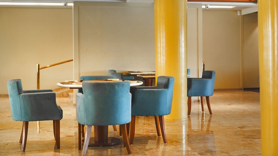 An image of seating area with sofa sets and a centre table placed in a room -  The Garden Ananta Elite, Rajkot