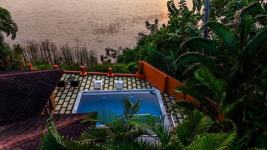 Private pool with a view of the lake at a resort.