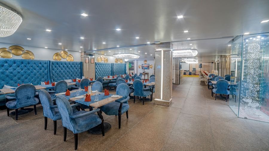 An indoor dining setup at a restaurant at Hotel Ashok Nagpur.