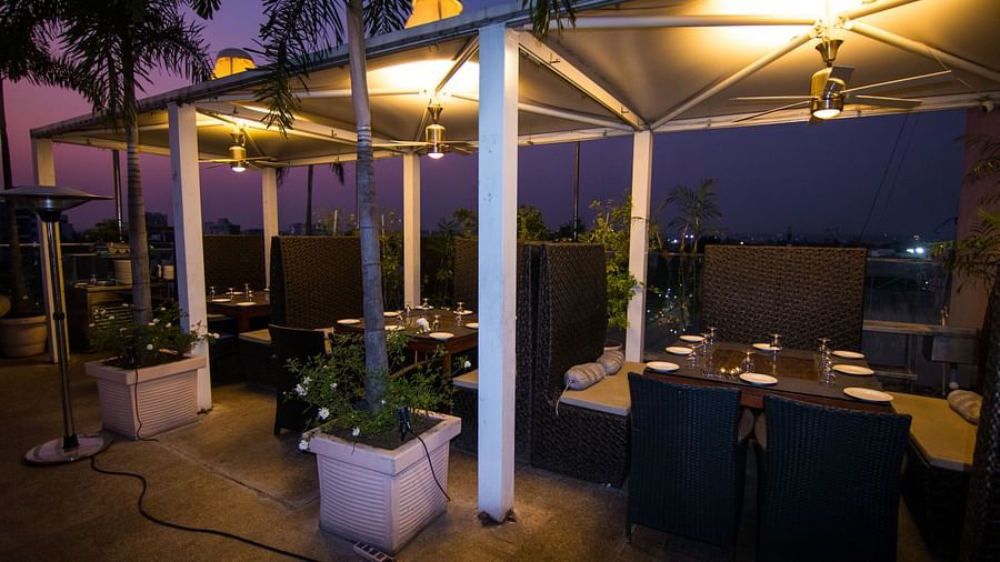 An outdoor dining setup at Hotel Ashok Nagpur.