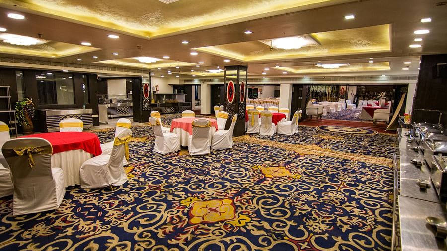 Maurya featuring round tables around chairs with patterned flooring and decorative ceilings.