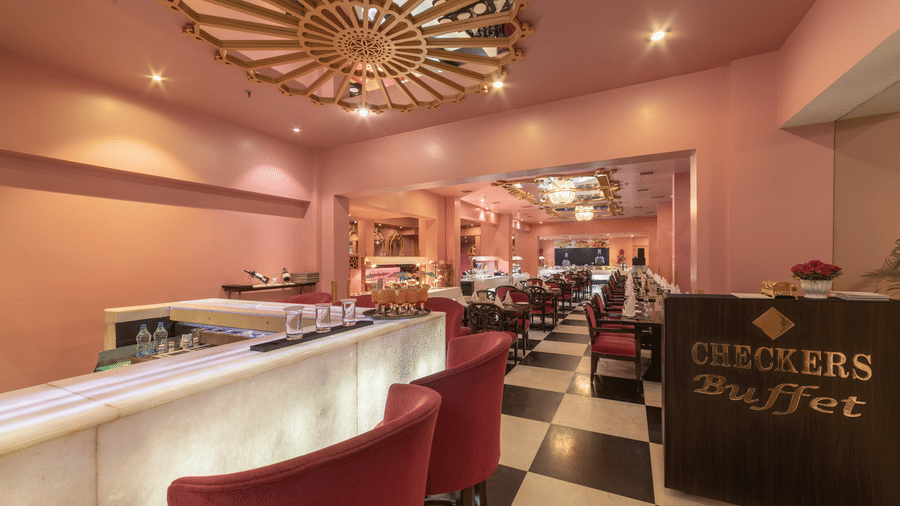 Stylish restaurant interior with comfortable seating, warm lighting, and a welcoming dining setup at Hotel Clarks Shiraz, Agra.