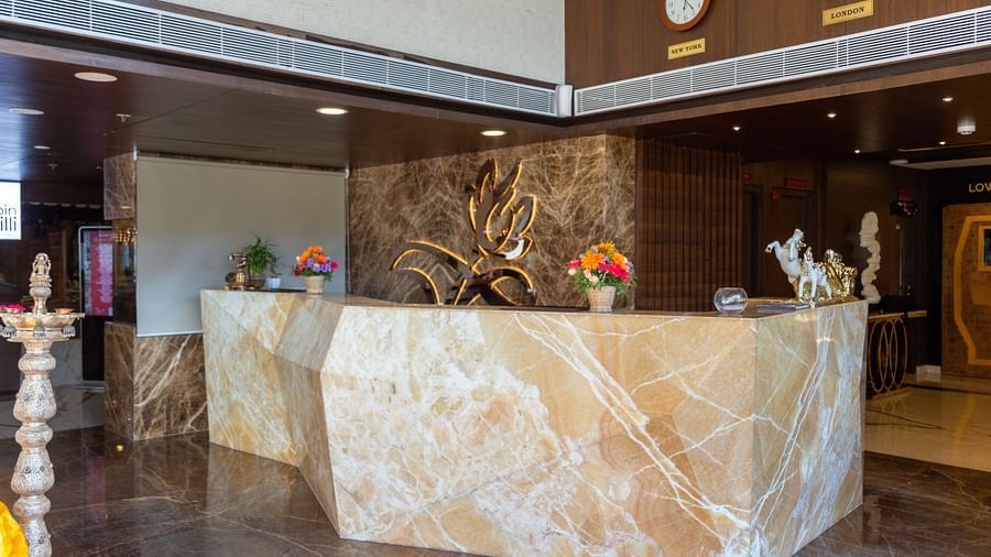 front view of hotel reception with decorations kept on the reception desk - Hotel Park Elanza, Chennai
