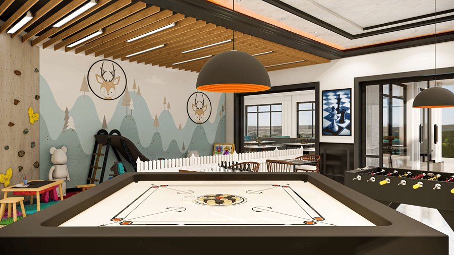 Recreation center inside the resort featuring a centered carrom board, overhead pendant lights, and indoor gaming equipment.