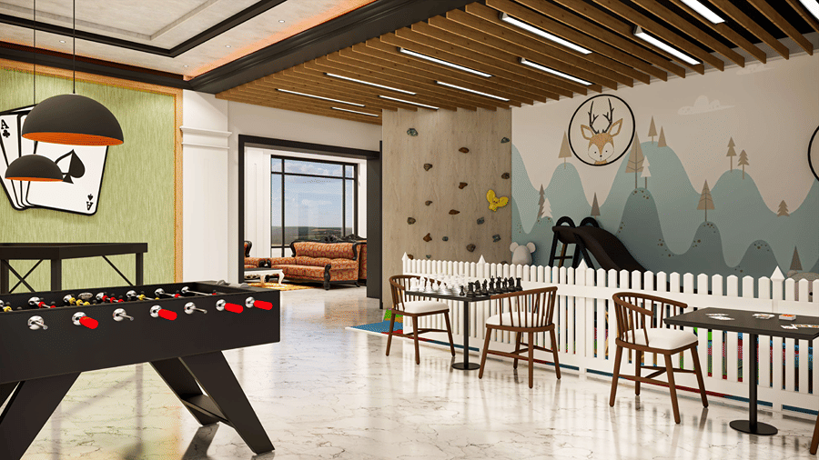 Hotel indoor recreation space featuring a foosball table, colorful wall graphics, and seating arrangements.