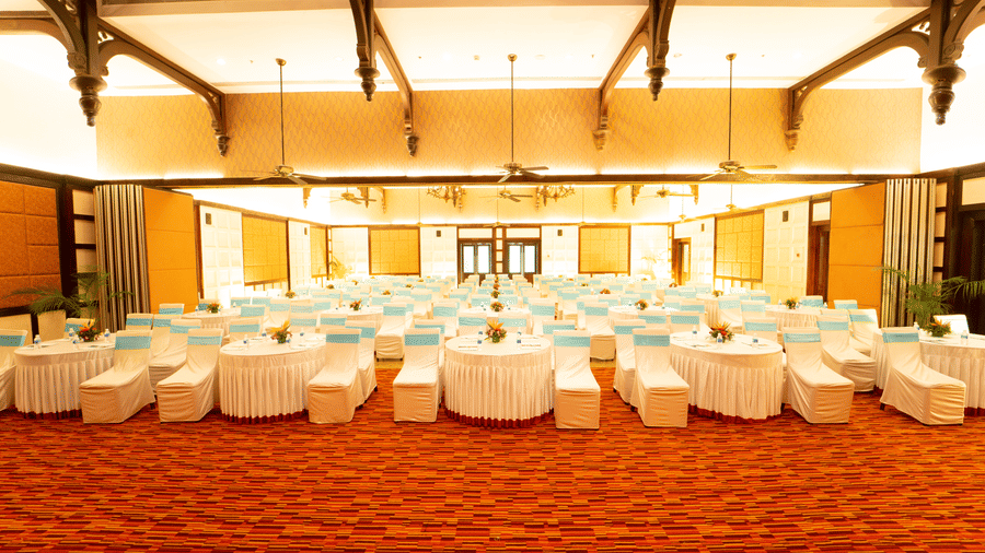 Trafalgar Square hall featuring chairs and tables at Ocean Spray Puducherry.