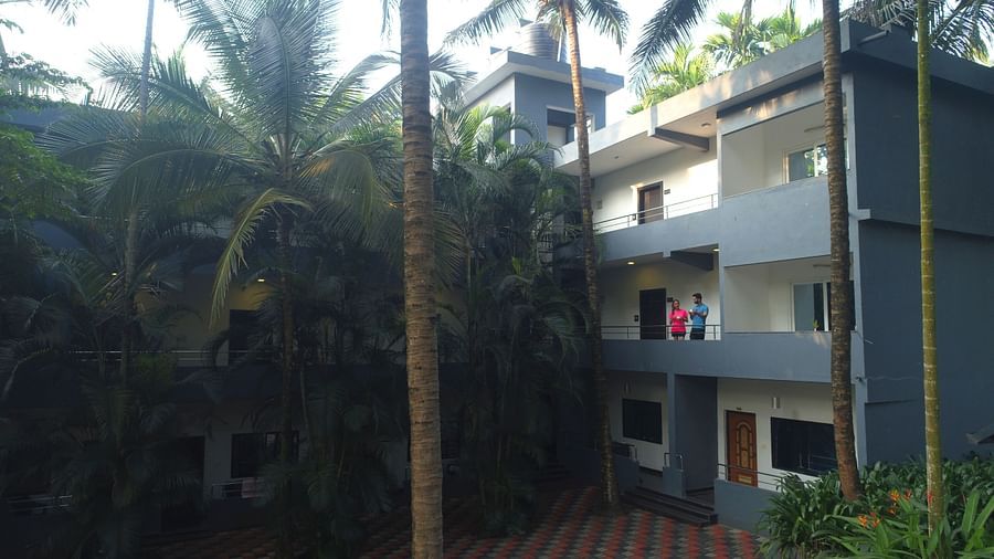Image of a building surrounded by trees at Parampara Resort & Spa, Kushalnagar.