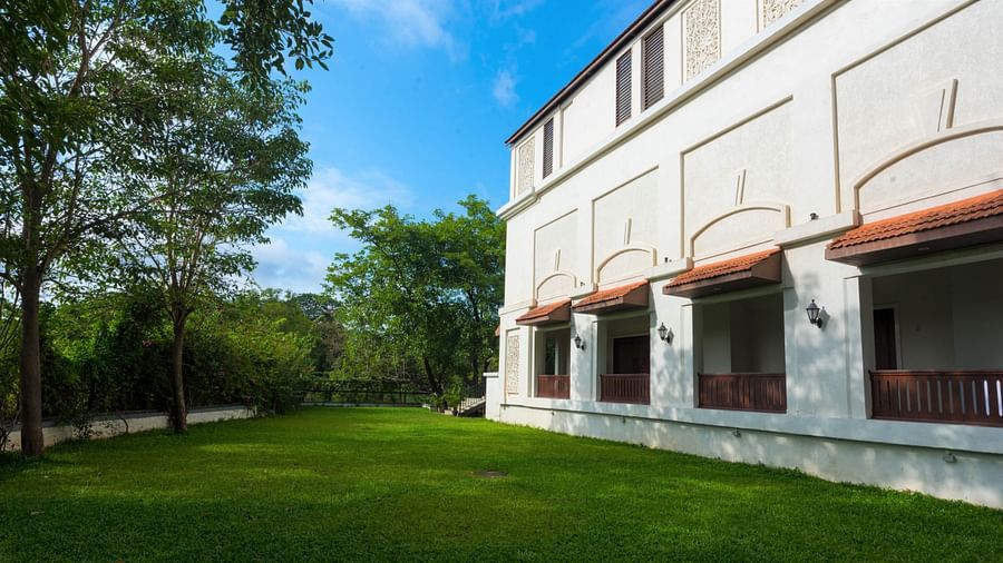 Lush green lawn surrounds the building - Rhythm Lonavala