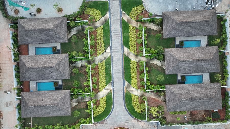Drone shot of The Shore Trishvam, Pondicherry featuring six villas with small private pools connected with a common pathway in the middle.
