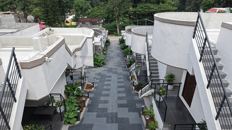 Closely arranged multi-story residential buildings and roads. | WOW Naturefull Resorts, Yercaud