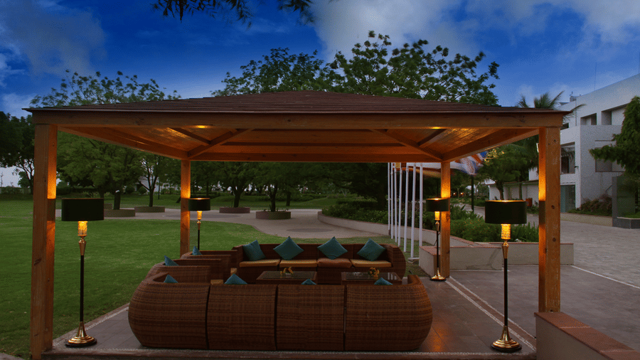 a gazebo in the Top3 Lords Resort Bhavnagar with a dim lit ambience under the evening sky