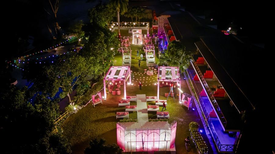 alt-text Aerial view of a lavishly decorated wedding venue at night.