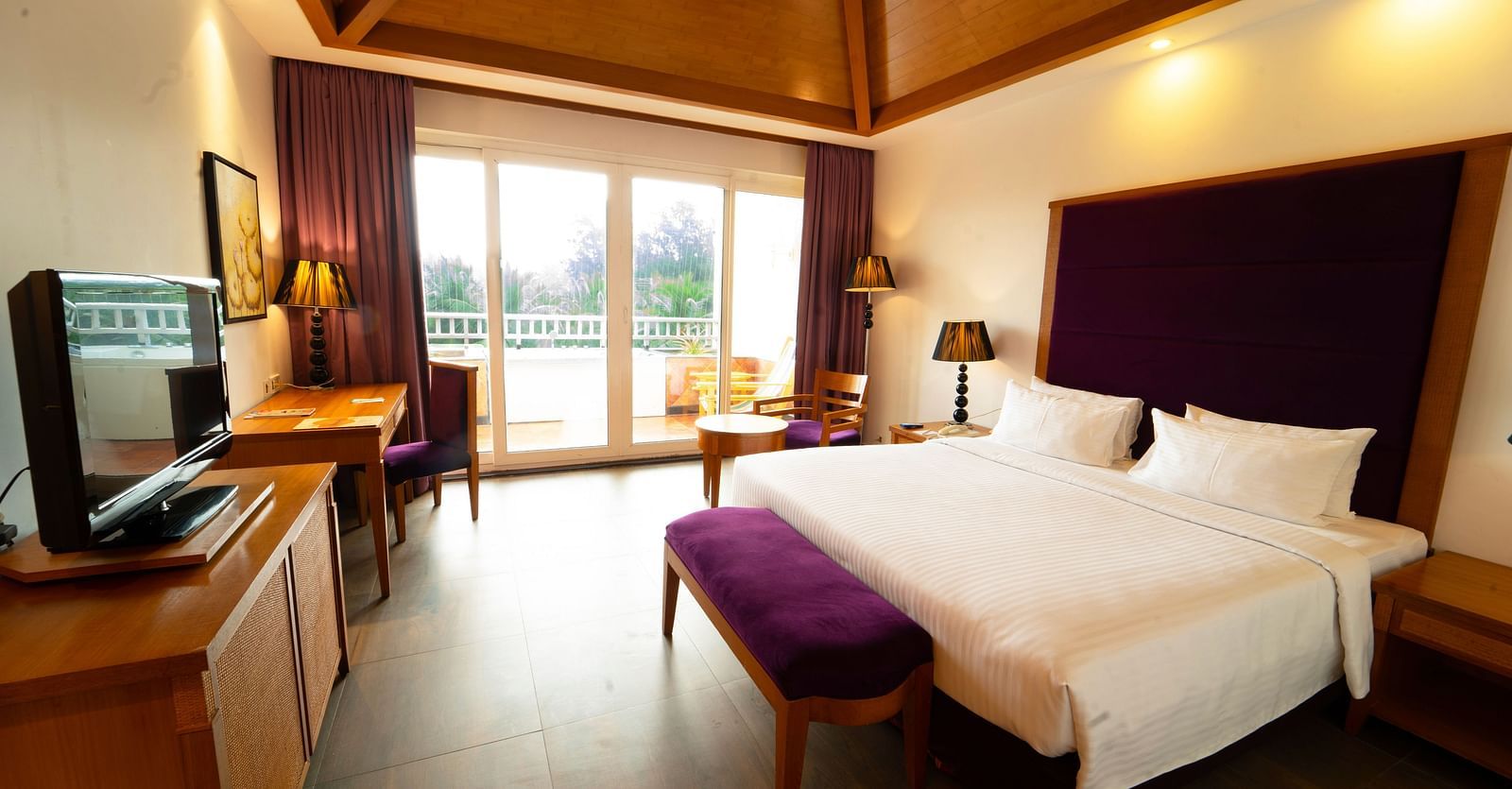 Heavens Room Interior with comfortable bed and ceiling to floor windows at Ocean Spray, Pondicherry 