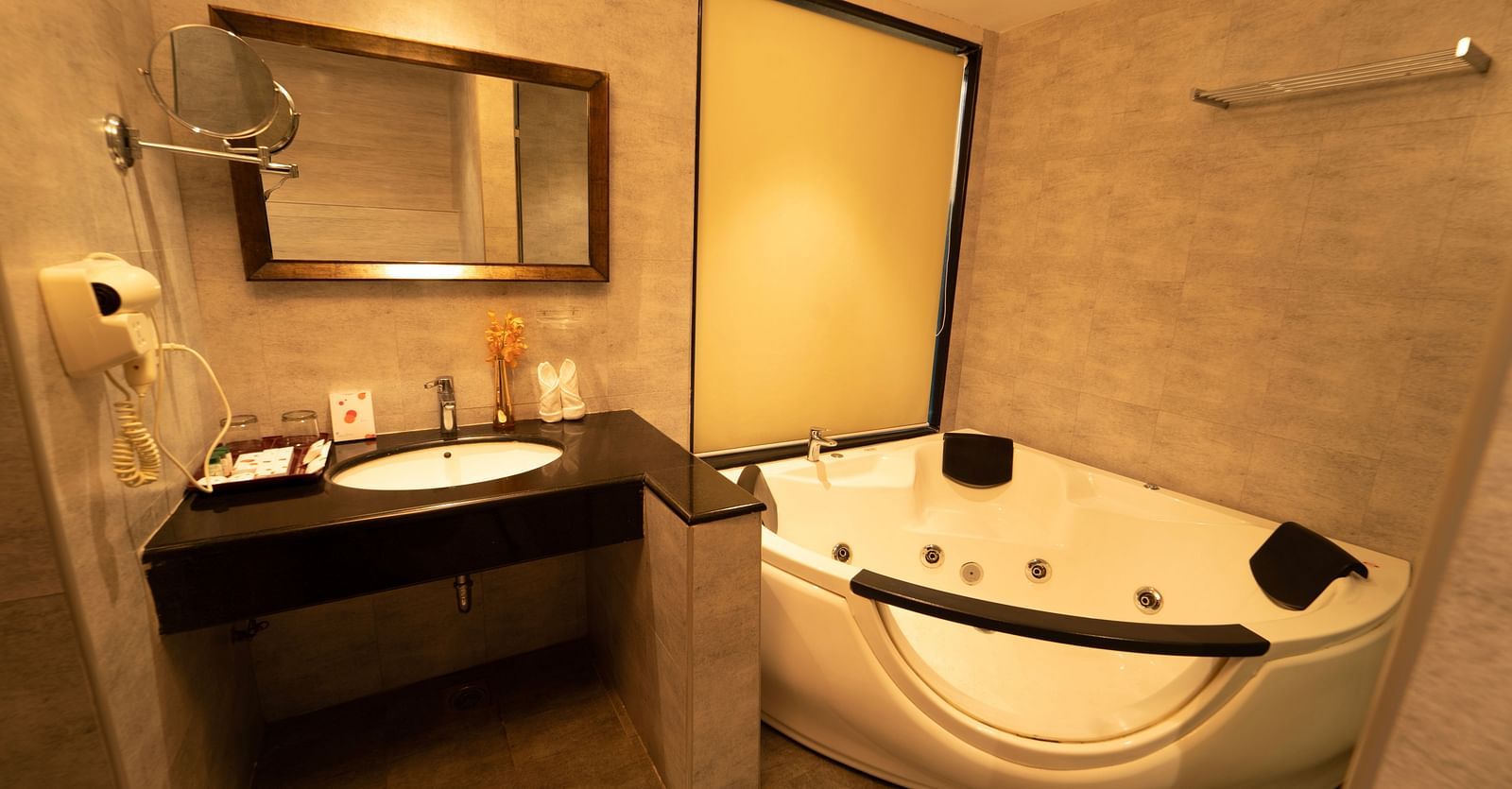 Santorini Villa Bathroom with bathtub and sink at Ocean Spray Puducherry