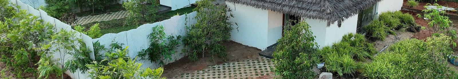 Bird eye view of the individual villas of the Pool View Bliss surrounded by a lot of plants at The Shore, Trishvam