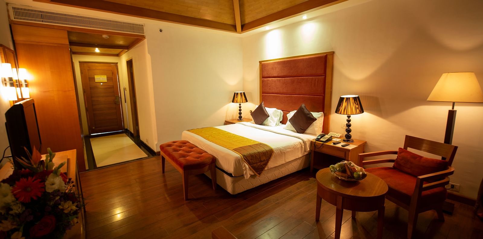a double bed inside HEAVENS Category Room at Ocean Spray Puducherry