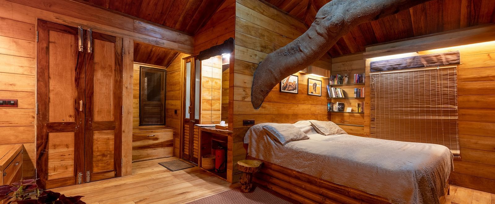 Another view of a snug tree house bedroom with a bed and wooden interiors - BluSalzz Collection - Tranquil Resort, Wayanad