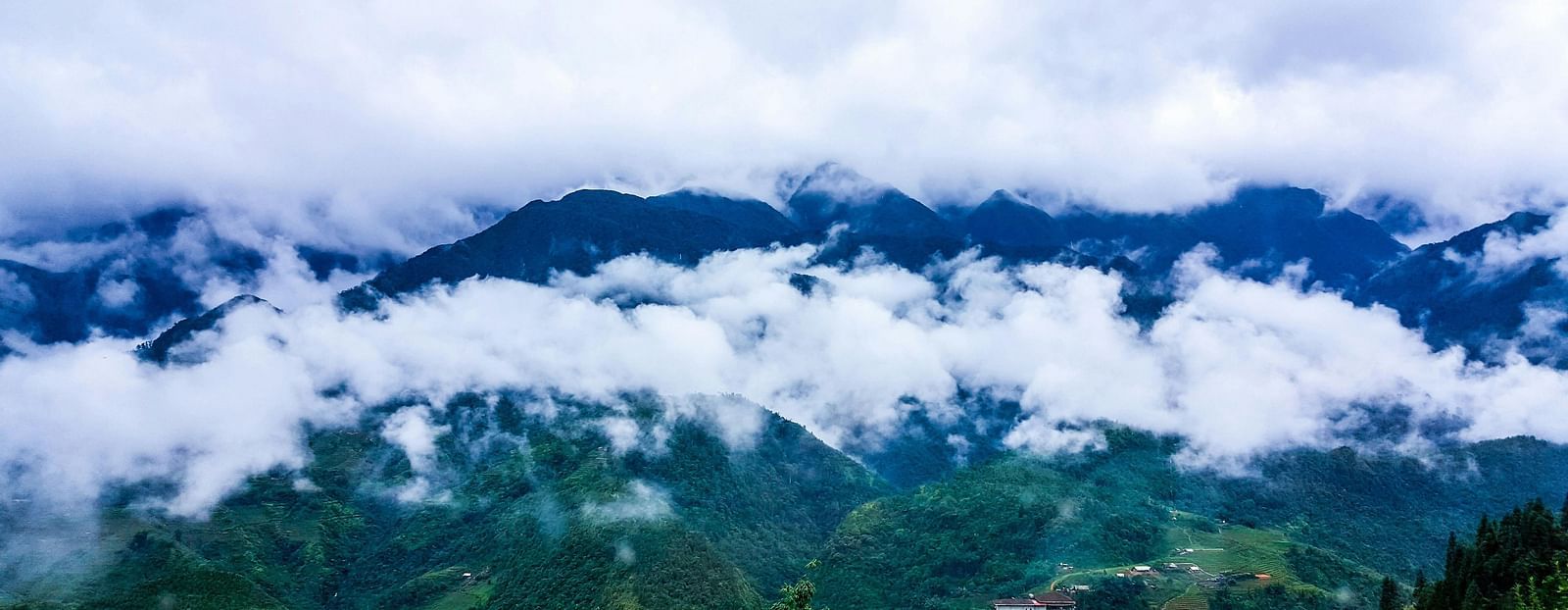 A mountain covered with clouds.