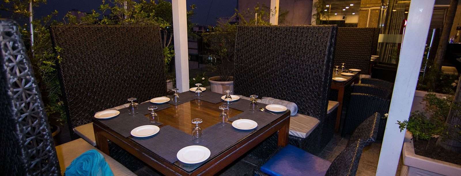 An outdoor dining setup at a restaurant at Hotel Ashok Nagpur.