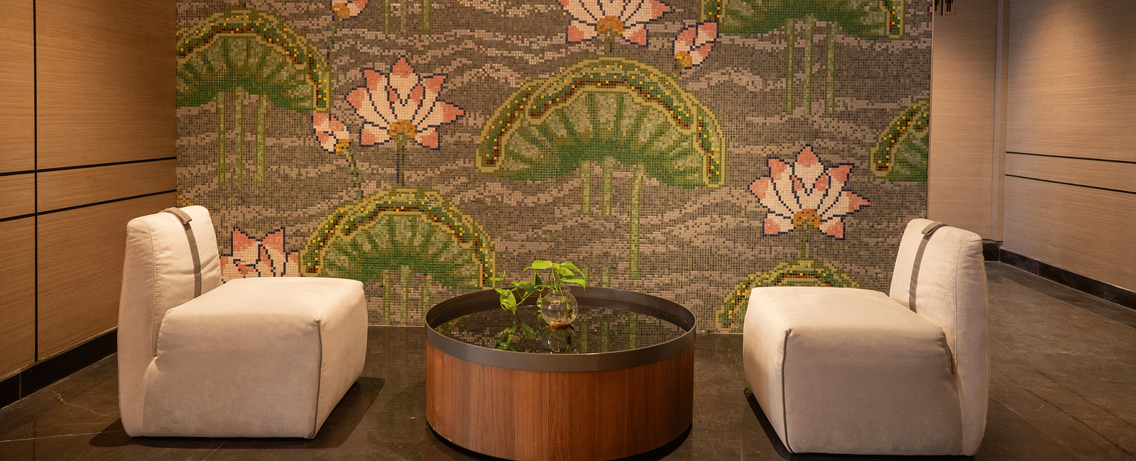 an image of the lobby with lotus wall painting at Zibe Luxe Kakinada by GRT Hotels