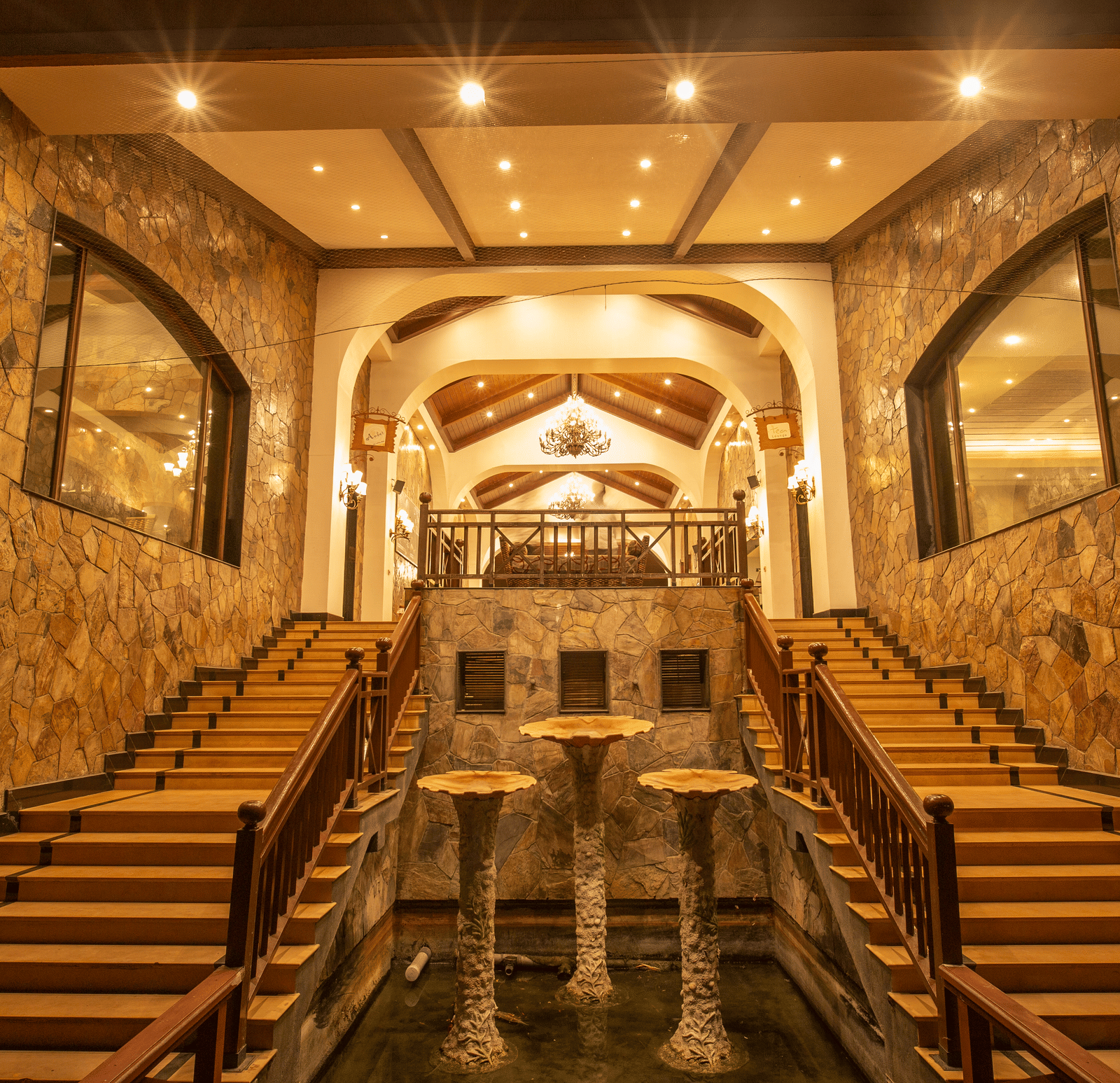 Night View of Lobby Facing West with staircase in view at Ocean Spray, Puducherry.