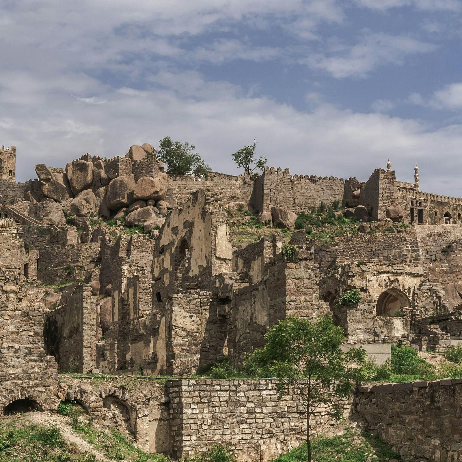 A wide, sprawling fort area against a cloudy sky.