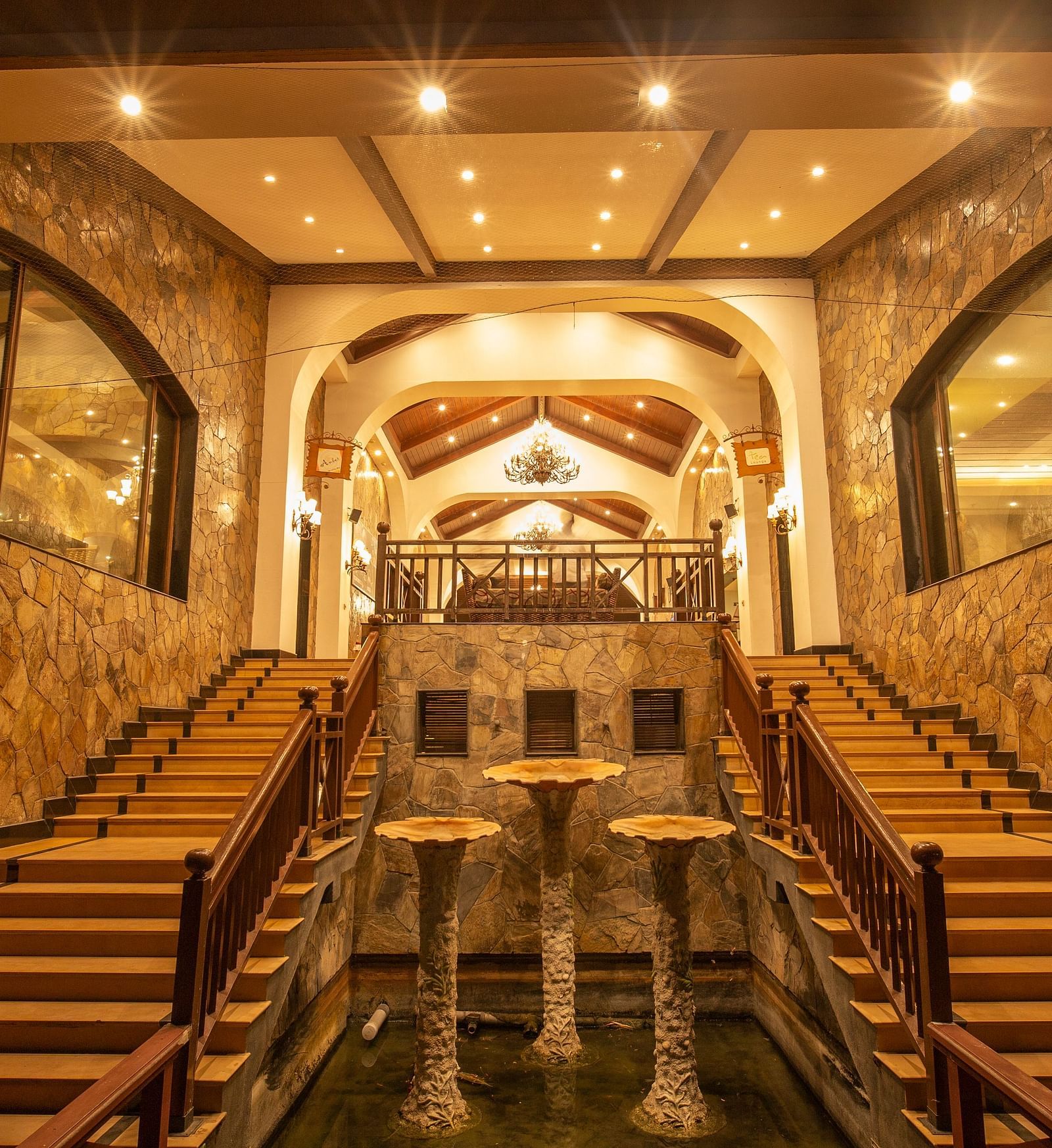 Night View of Lobby Facing West with staircase in view at Ocean Spray Puducherry