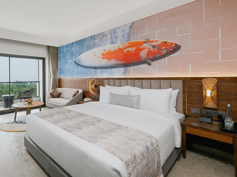 an image of a bedroom with a balcony view at Cloud9 Sarovar Premiere, Palolem Goa