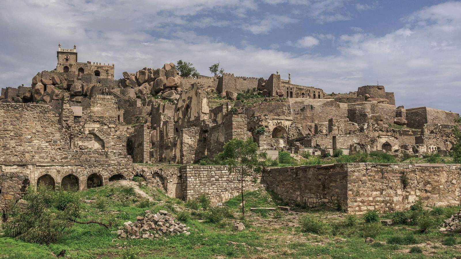 A wide, sprawling fort area against a cloudy sky.