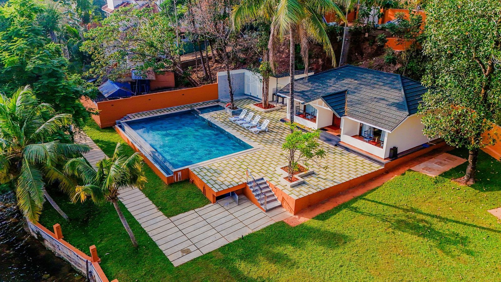 Aerial view of a private villa with a swimming pool at a tropical resort - Fragrant Nature Kollam Resort Photos