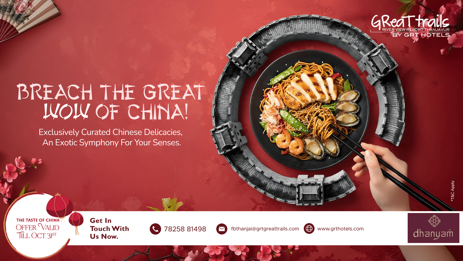 A dish of Chinese noodles with chicken, prawns, clams, and vegetables on a black plate, framed by the Great Wall replica at GReaT trails River View Resort Thanjavur by GRT Hotels.