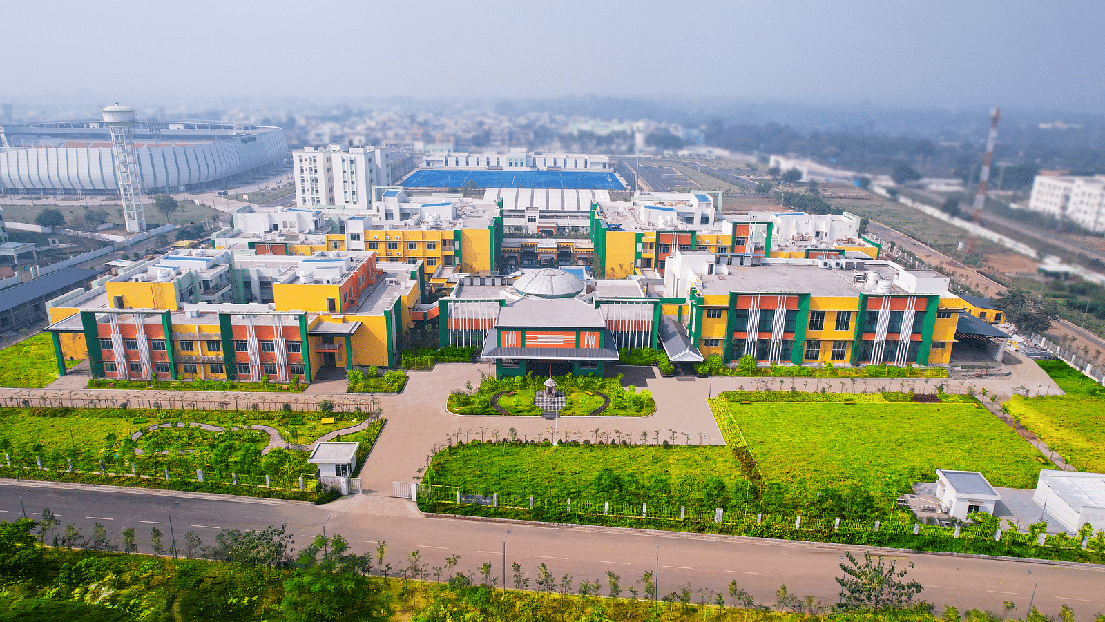 Aerial view of Mayfair World Cup Village, Rourkela, showcasing the vibrant and expansive facade of the hotel complex.