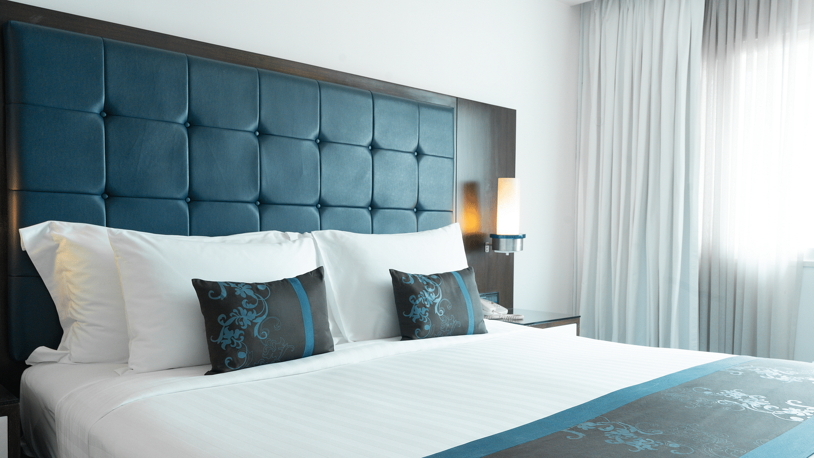 Bronze King Room featuring a close up shot of the bed - Night Hotel Bangkok.
