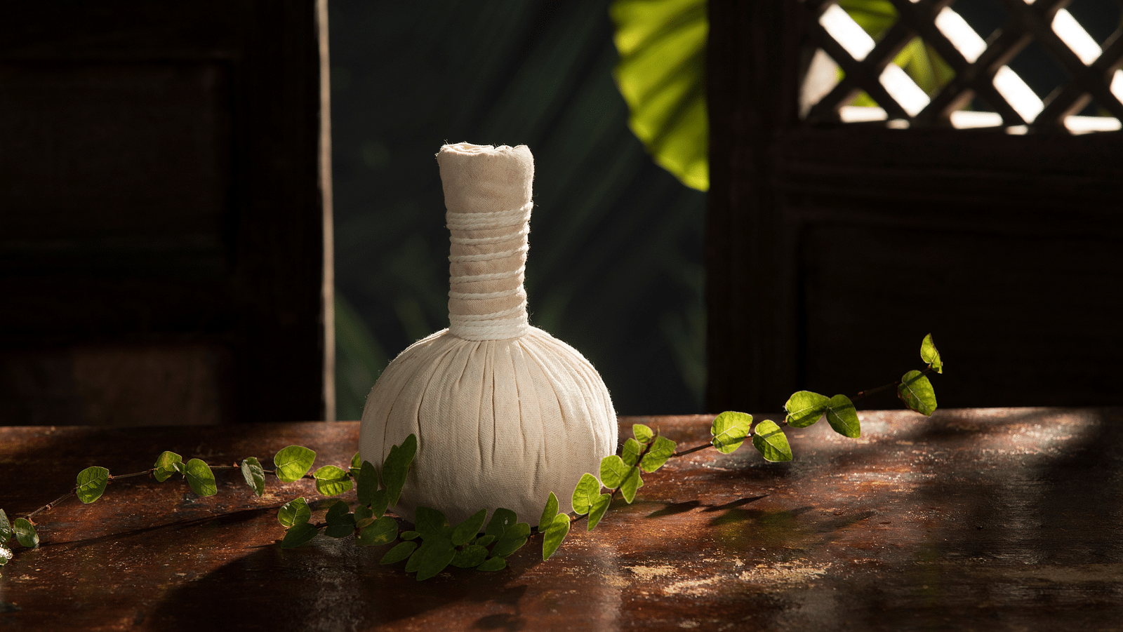 an image of a potli placed on a table - Rhythm Kumarakom
