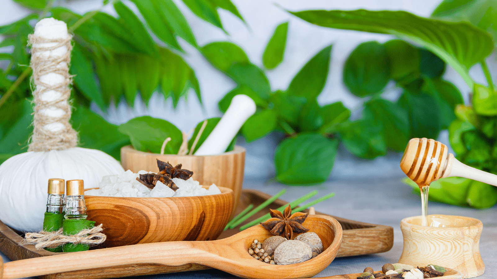 an image of spa materials and honey placed together - Rhythm Kumarakom