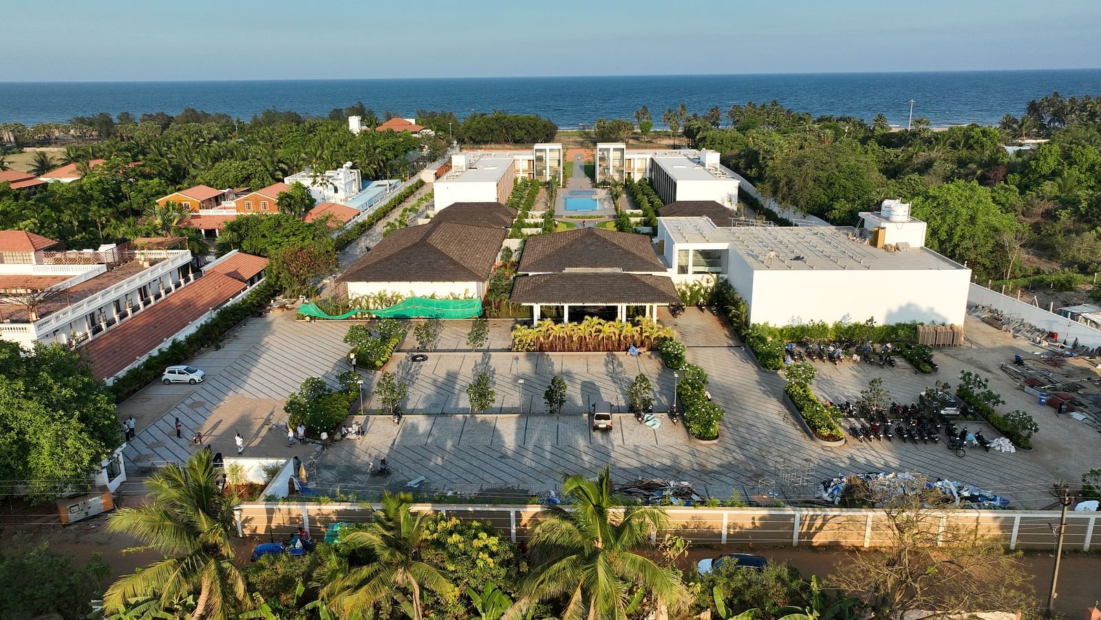A birds eye view of the resort featuring a spacious parking area at The Shore Trishvam, Pondicherry.