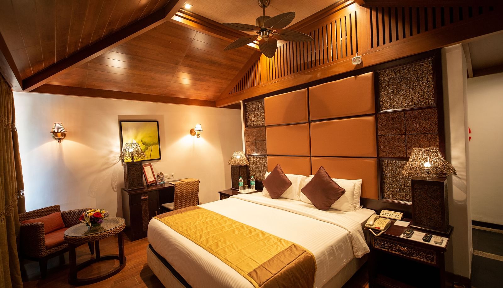 a double bed inside BERMUDA Villa Wooden themed bedroom at Ocean Spray Puducherry