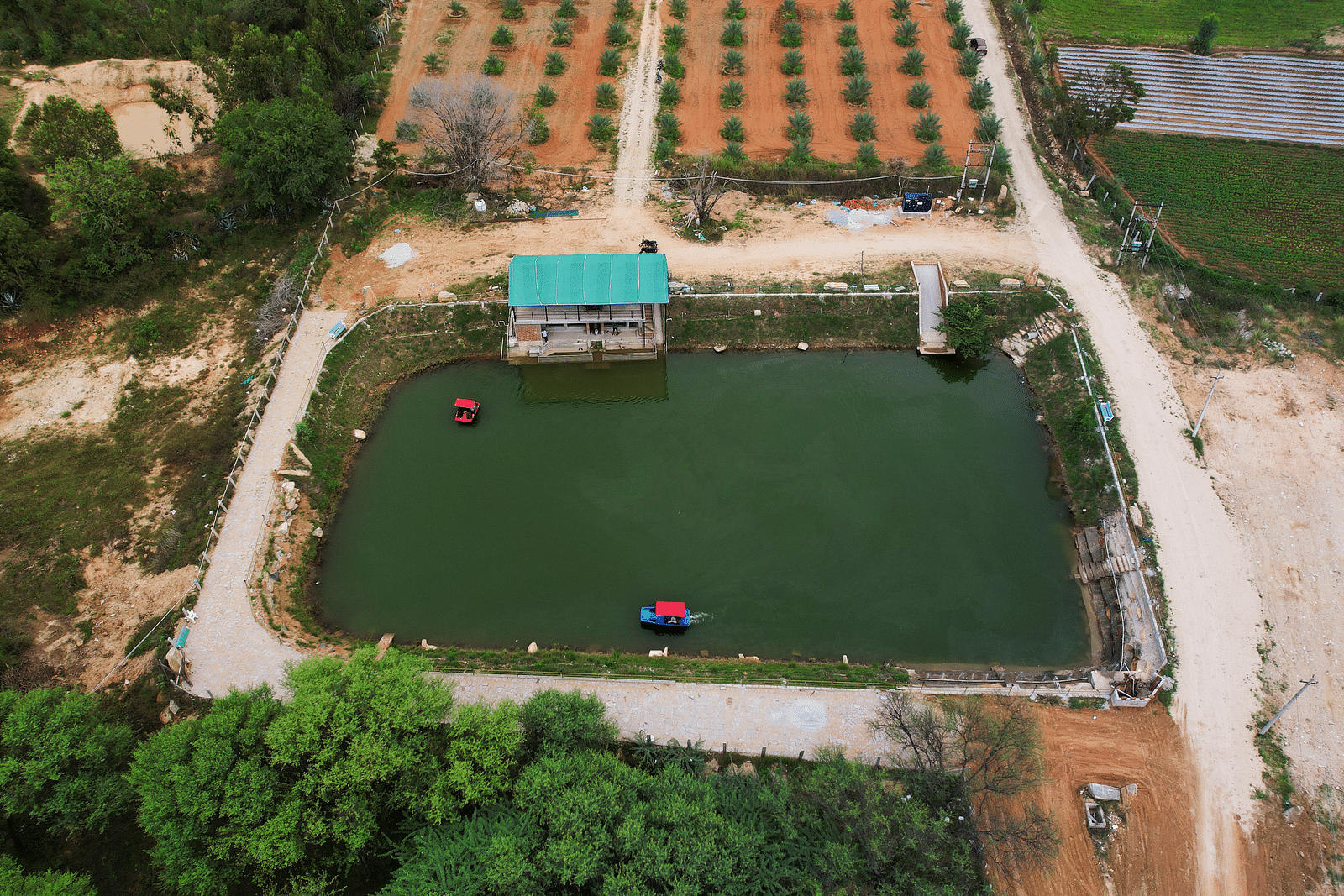 Top view of a Water body with a small house next to it