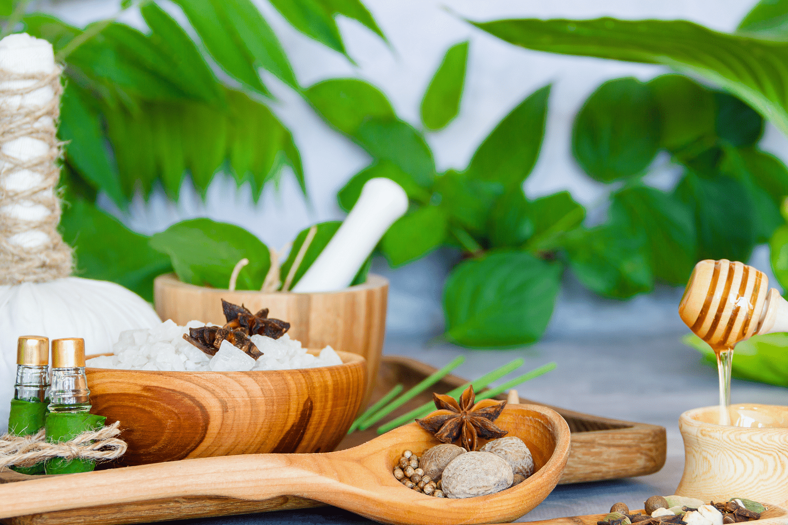 an image of spa materials and honey placed together - Rhythm Kumarakom