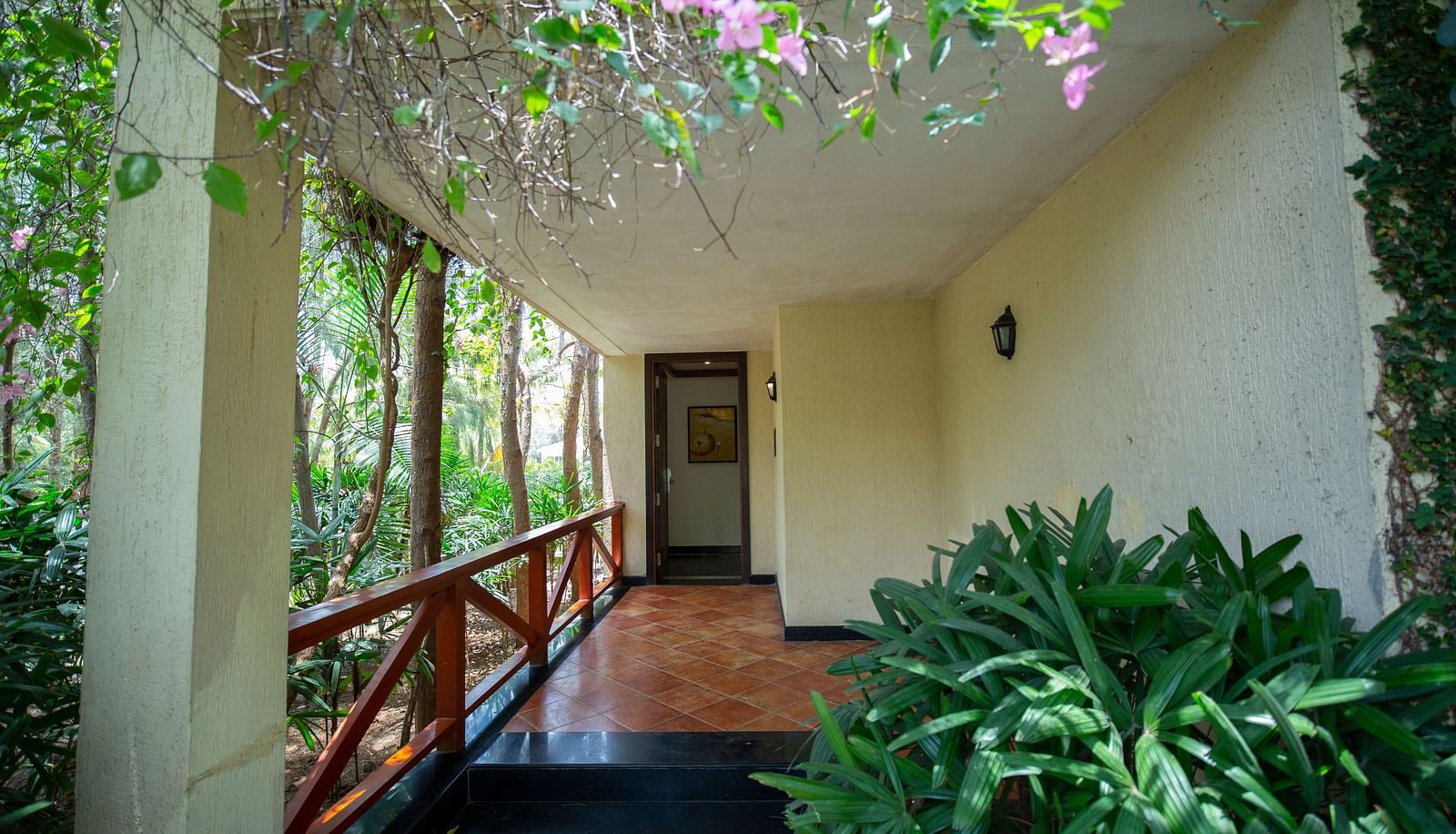 Bermuda Villa Entrance View surrounded by lush greenery at Ocean Spray Puducherry
