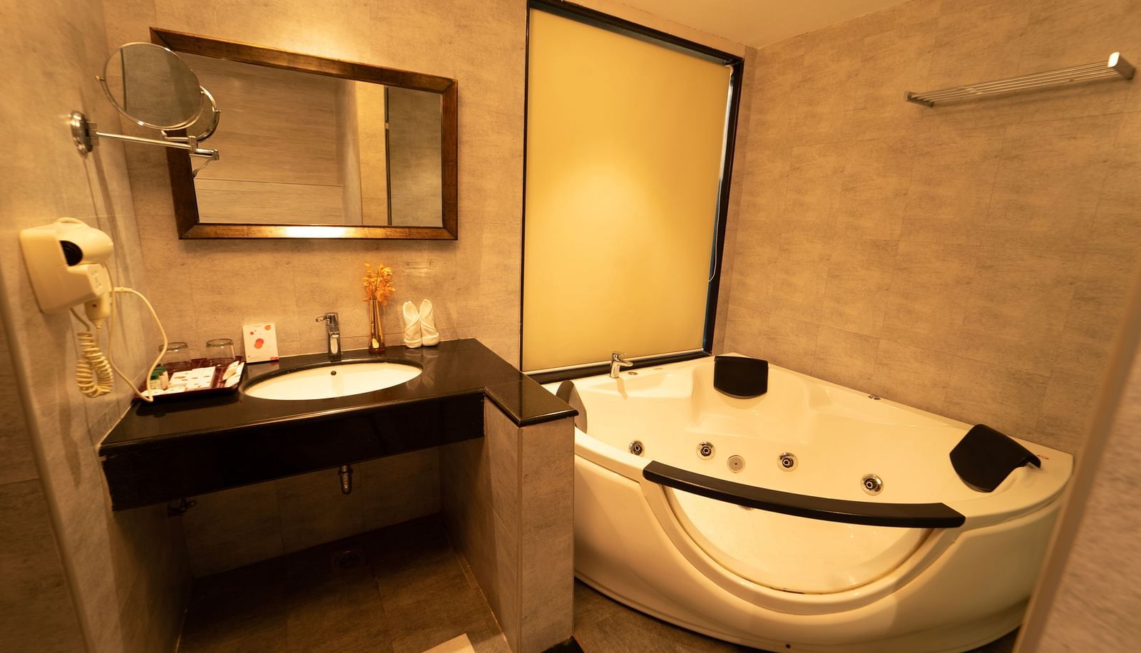 Santorini Villa Bathroom with bathtub and sink at Ocean Spray Puducherry