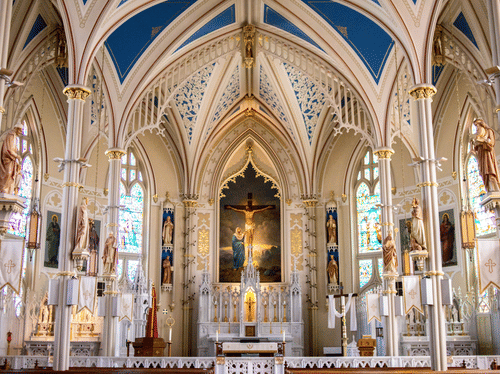 Intricate interiors of a church with an idol in the centre
