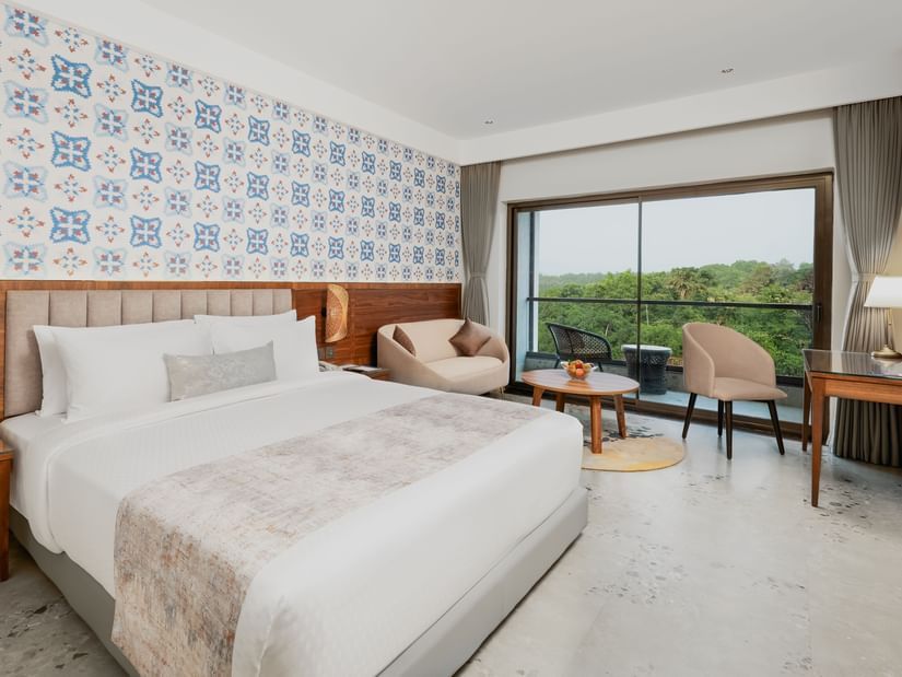 an image of a bedroom featuring a balcony with valley view at Cloud9 Sarovar Premiere, Palolem Goa
