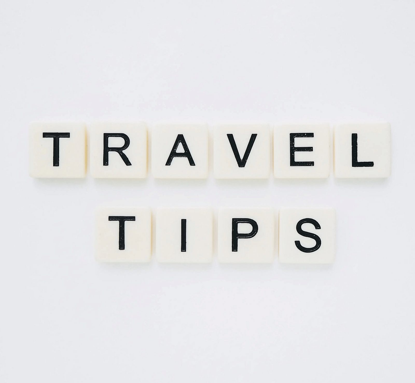 Few small blocks spelling the phrase 'travel tips'.